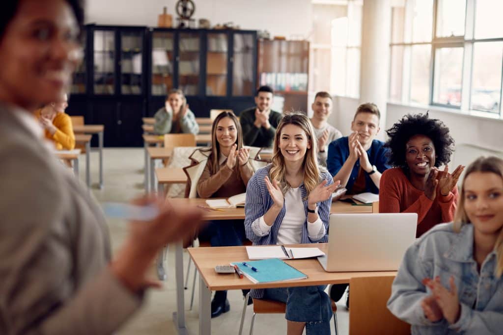 Group of happy students in a classroom