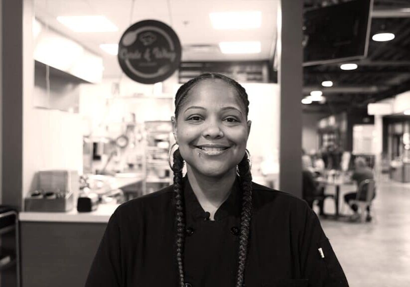 Chef/Owner of Curds and Whey, Faith Walker, smiling in restaurant