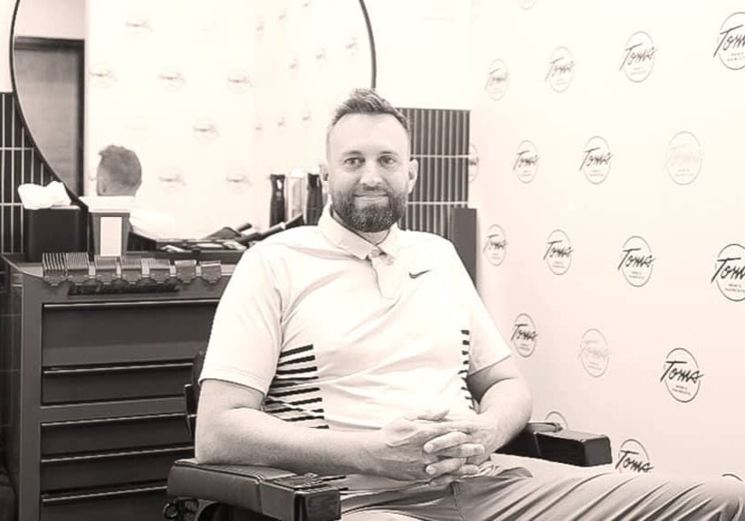 Justin Moore inside of Toms Men’s Haircuts